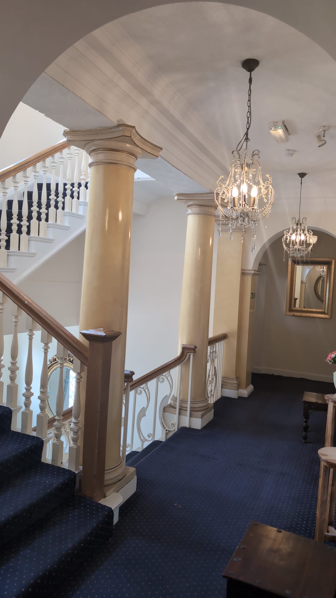 Grand staircase with carved Victorian columns at The Royal Hotel, Skegness