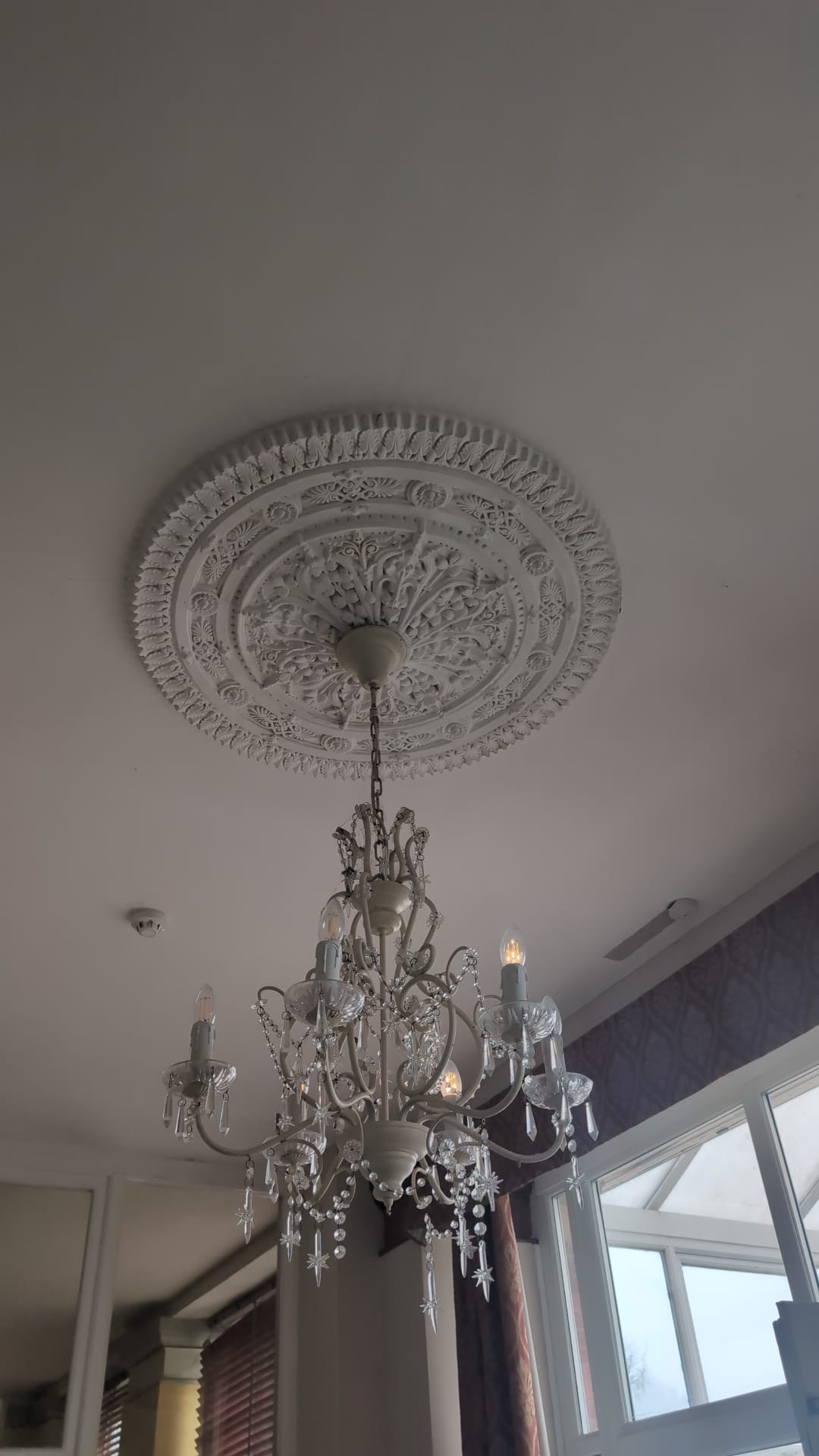 Ornate white-painted chandelier