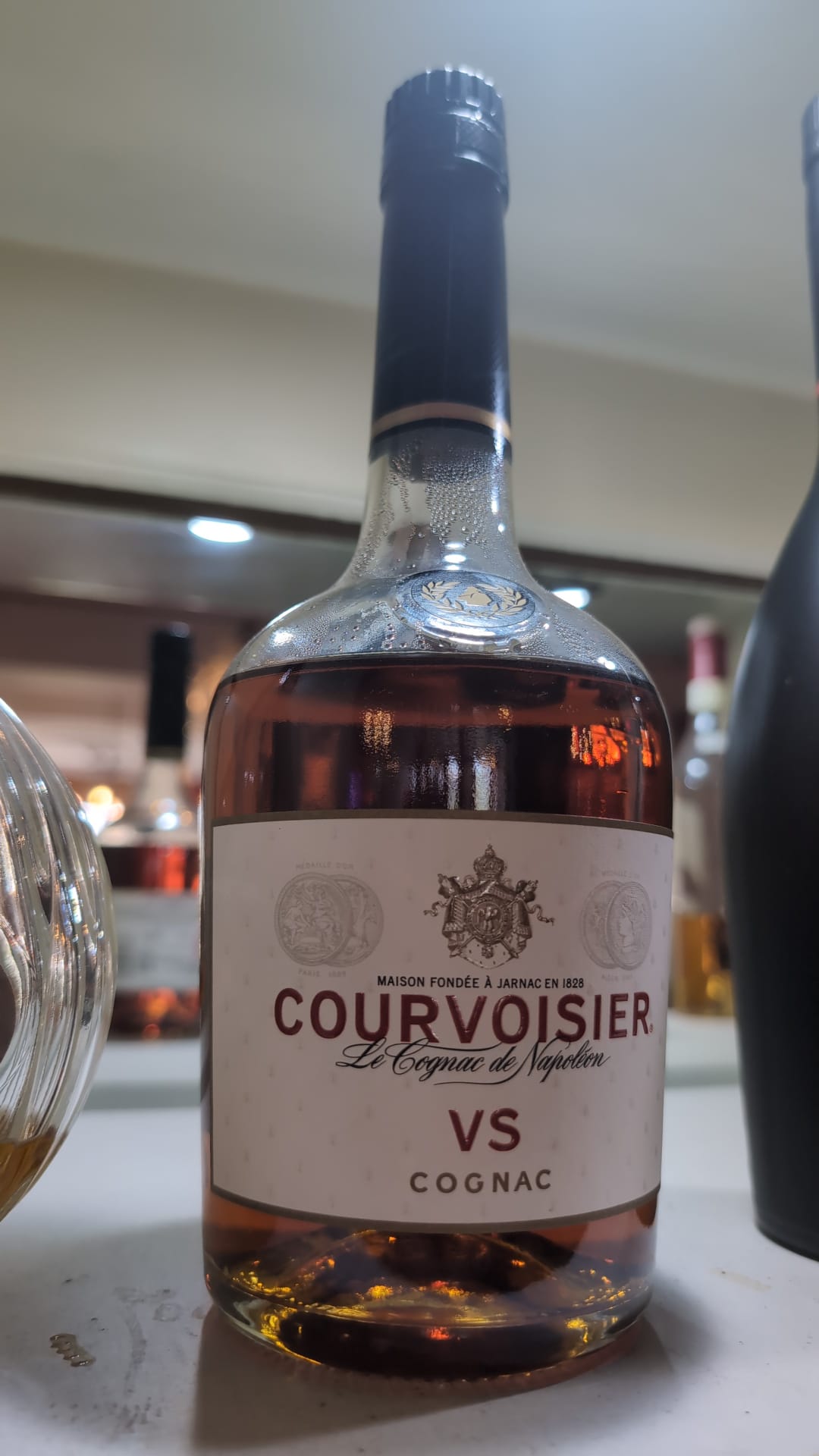 Bottle of Courvoisier on the back bar