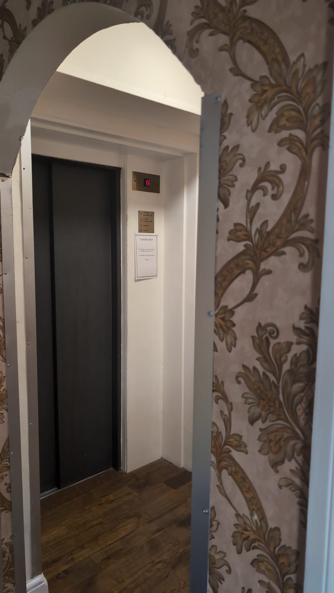 Carved interior doorway with stained glass surround