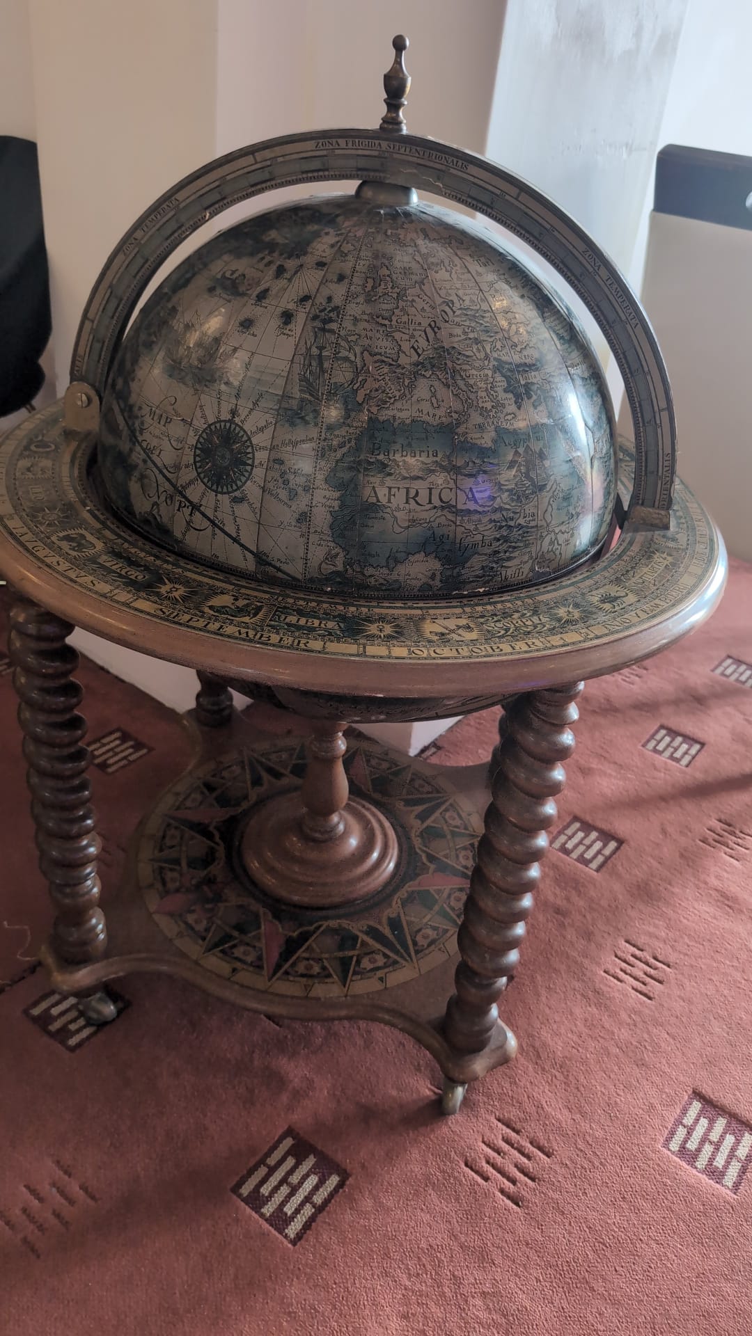 Antique terrestrial globe on a wooden stand