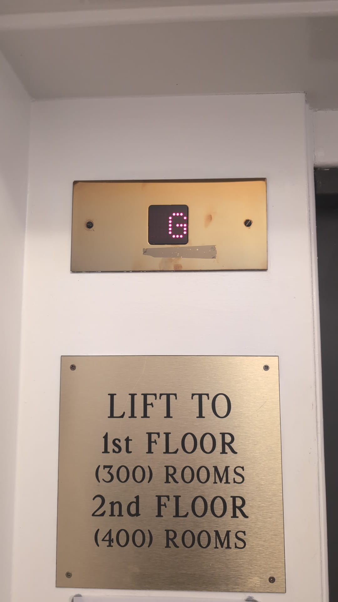 Guest lift with brass surround