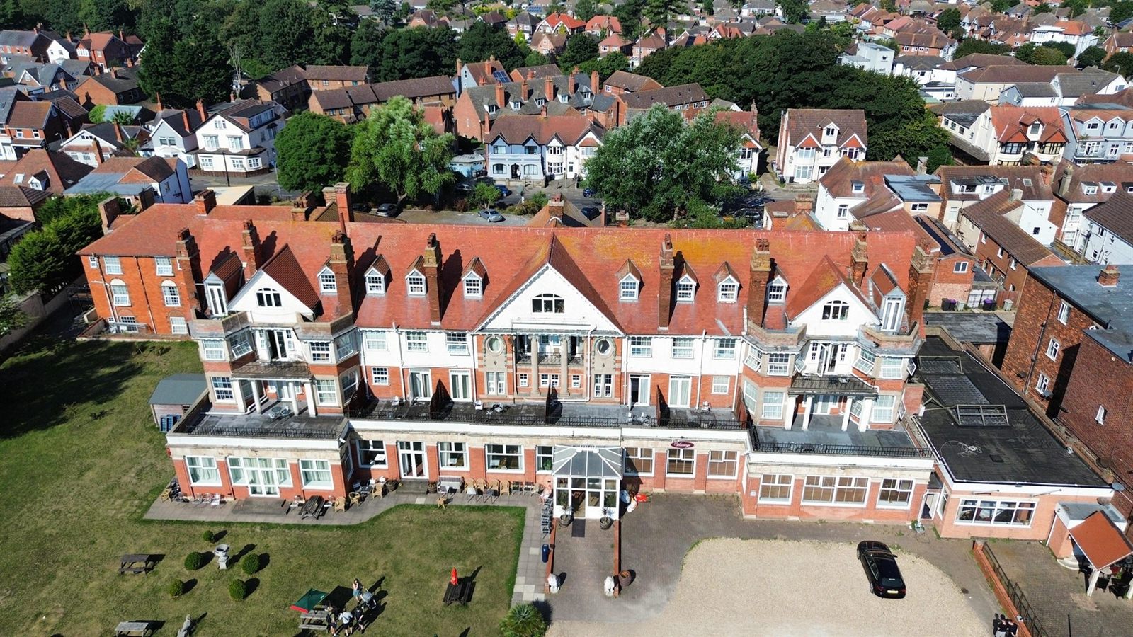 Overhead view of the hotel facade and forecourt