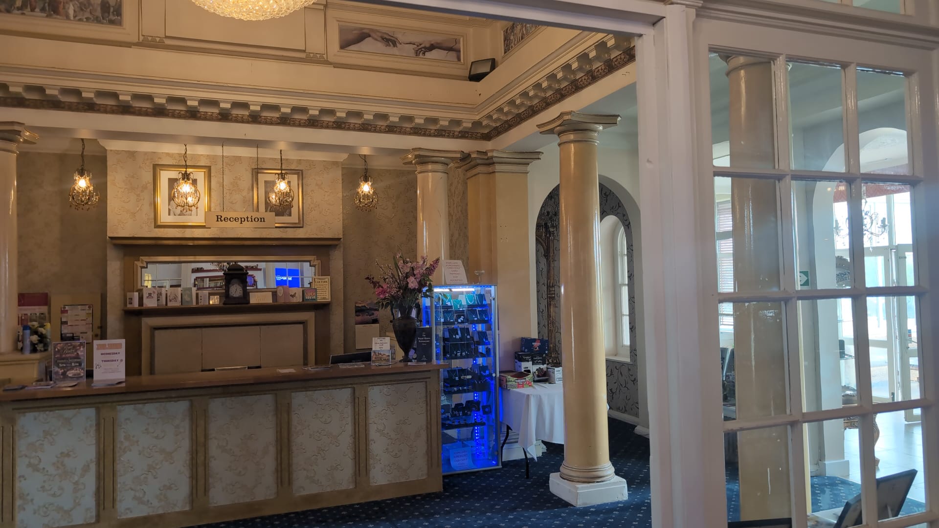 Reception desk between marble columns